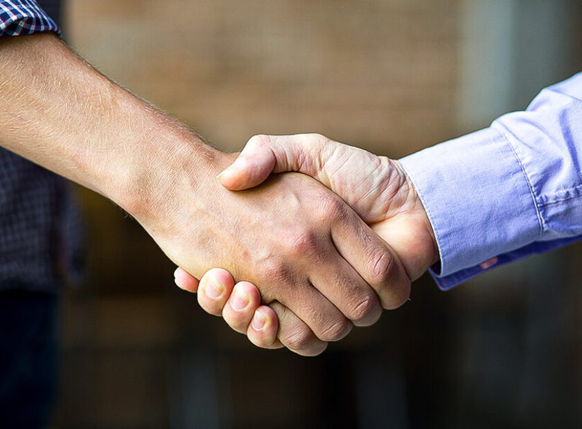 Closeup of Two Business Men Shaking Hands